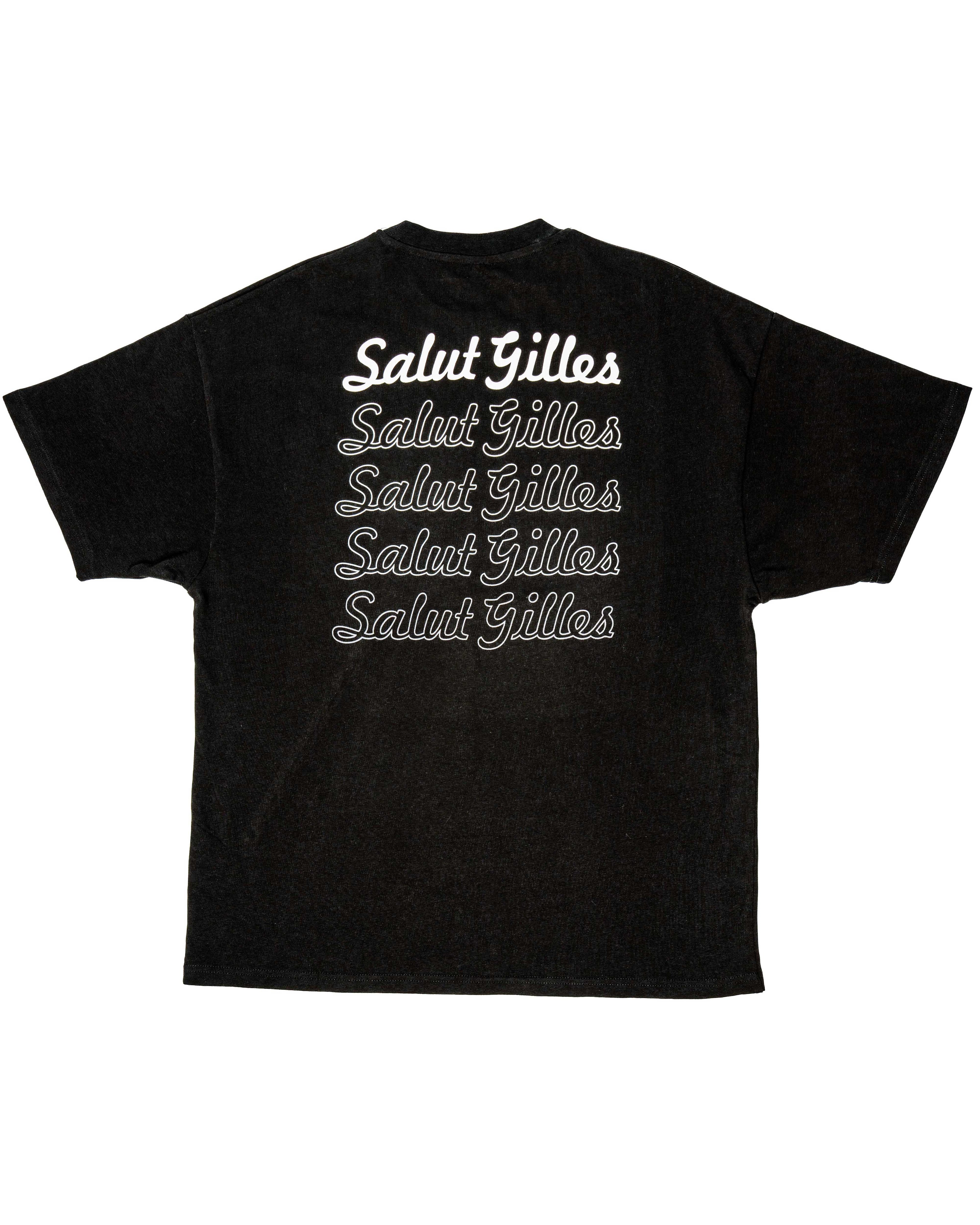 T-shirt noir à plat, vue arrière, montrant l’inscription ‘Salut Gilles’ et le texte complet.