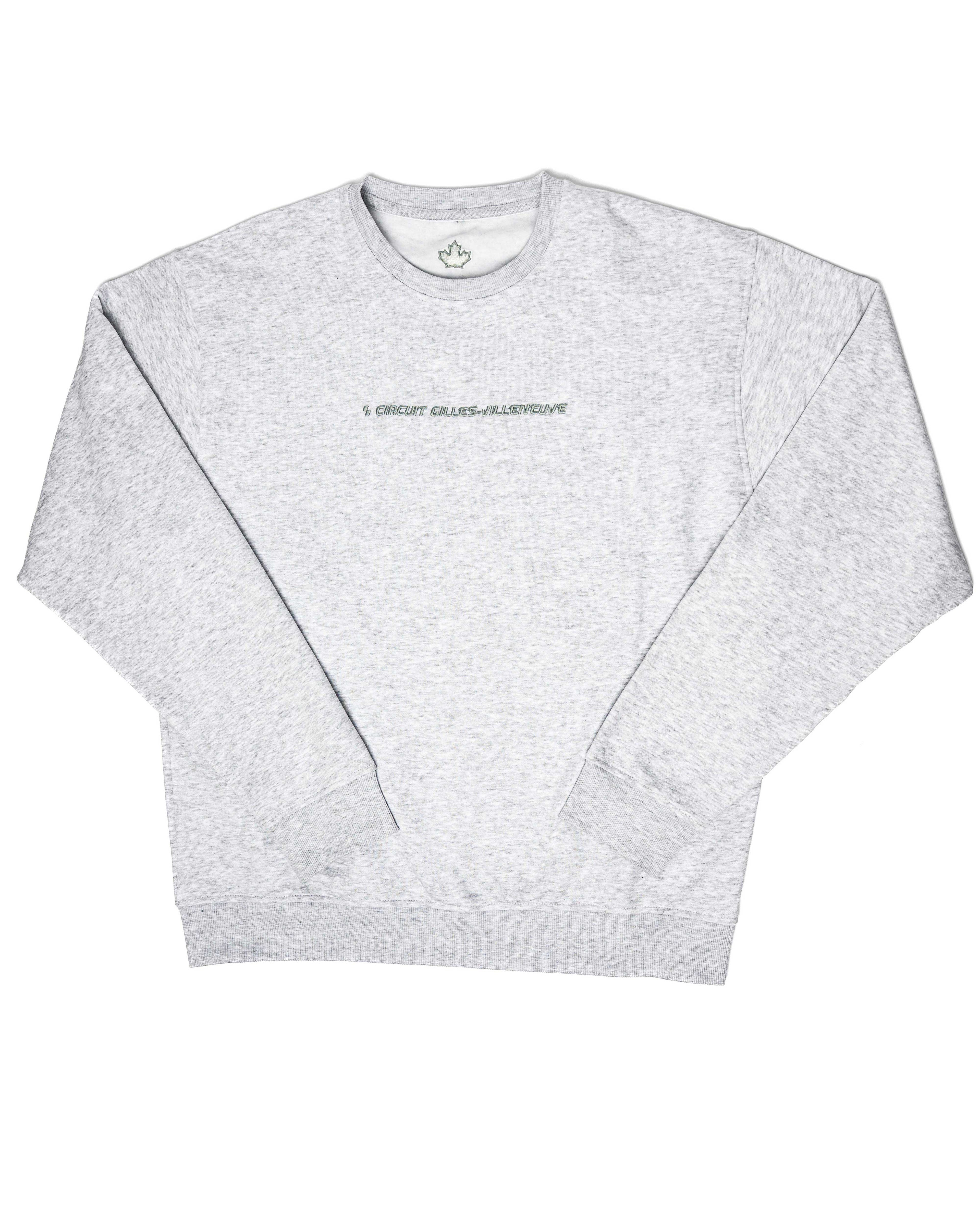 Crewneck gris clair à plat, mettant en valeur la broderie minimaliste au centre.