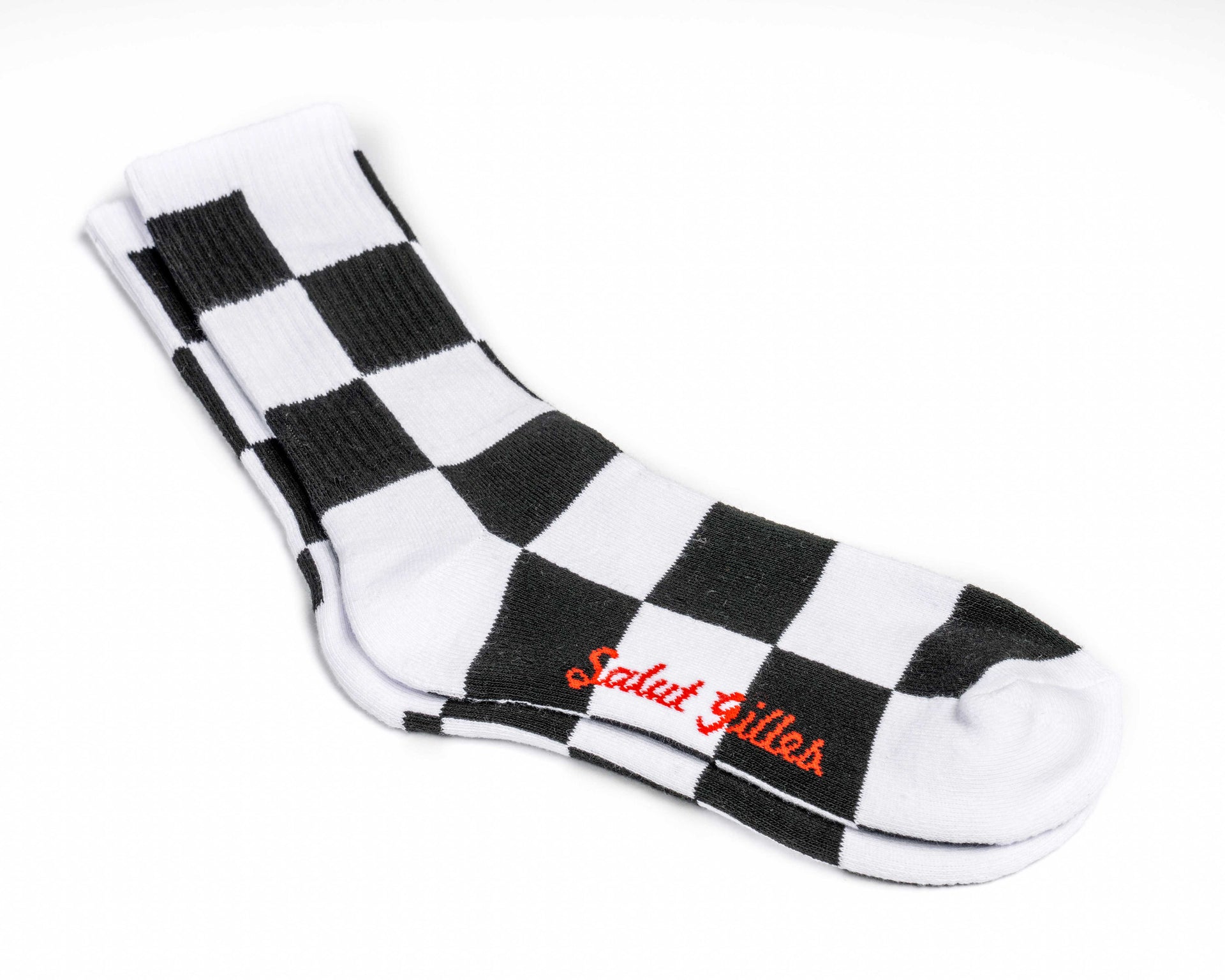 Paire de bas CGV noir et blanc à motif damier avec logo CGV en rouge.